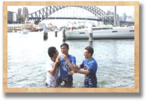Erick being baptized before church on Sunday in front of the Sydney Harbor Bridge!